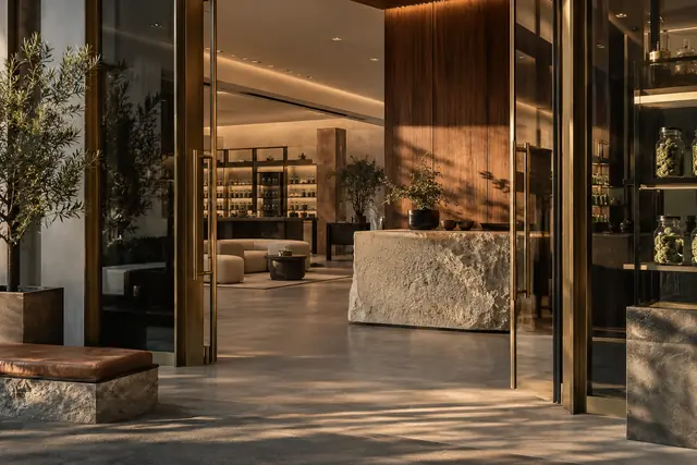 Warm boutique entrance framed in brass
